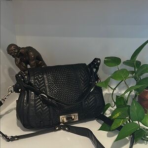 Rebeca Minkoff  Sleek Black Leather Shoulder Bag with Gold Hardware.